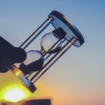 person holding hour glass
