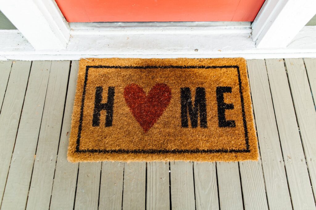 brown home printed rug beside door